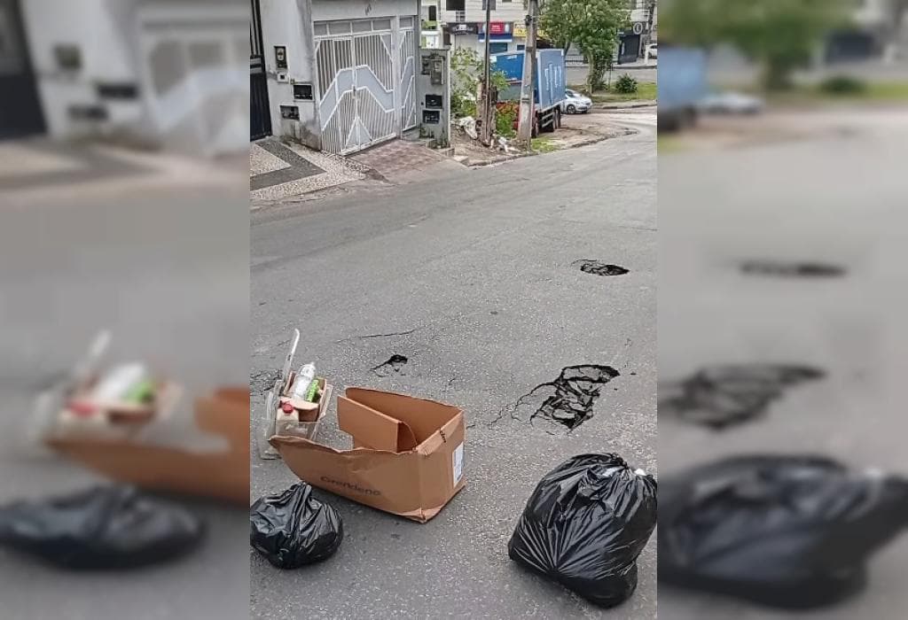 Rua Aracaju em Santo Antônio de Jesus com asfalto danificado por rompimento de tubulação da Embasa