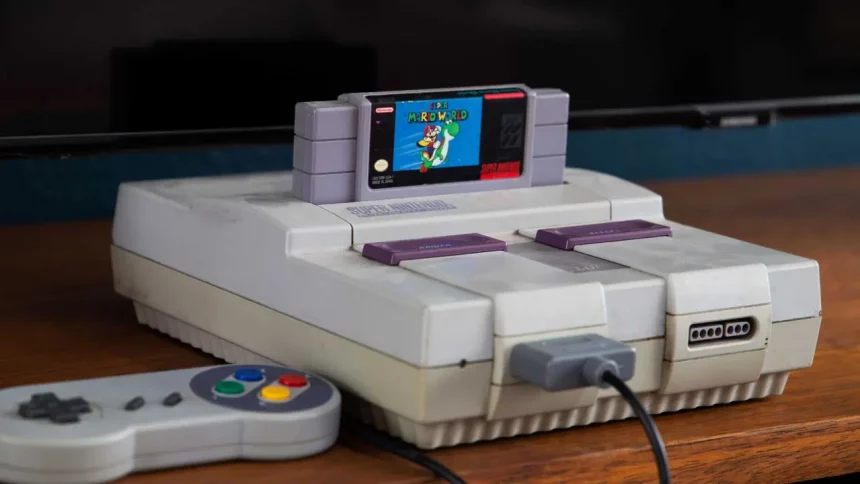 Console Super Nintendo Antigo Com Controle E Televisão Ao Fundo. / Crédito: Advtp (Shutterstock/Reprodução)